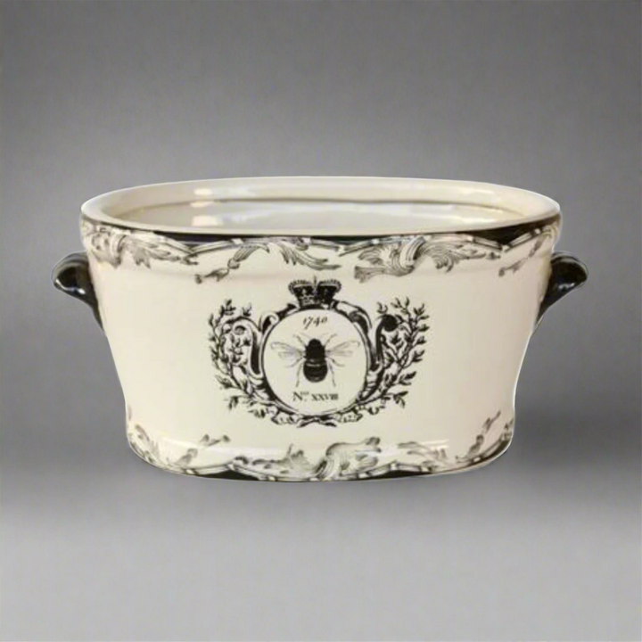 Large Black &amp; White Bee Planter
Elevate your space with a touch of whimsy and sophistication! Our Large Black &amp; White Bee Planter is a stylish ceramic masterpiece featuring a vibrant bee motif that's sure to captivate anyone's attention. Whether you're looking to add a decorative piece to your indoor space or a charming accent to your outdoor garden, this beautiful planter is the perfect choice. Unique Boys.