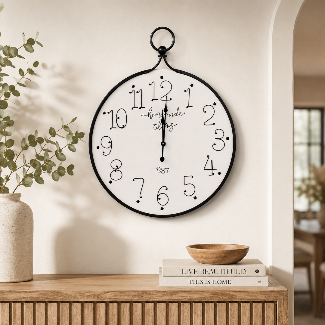Large 100x80cm black and white iron clock with bold numerals, ideal for elegant feature walls and living spaces.