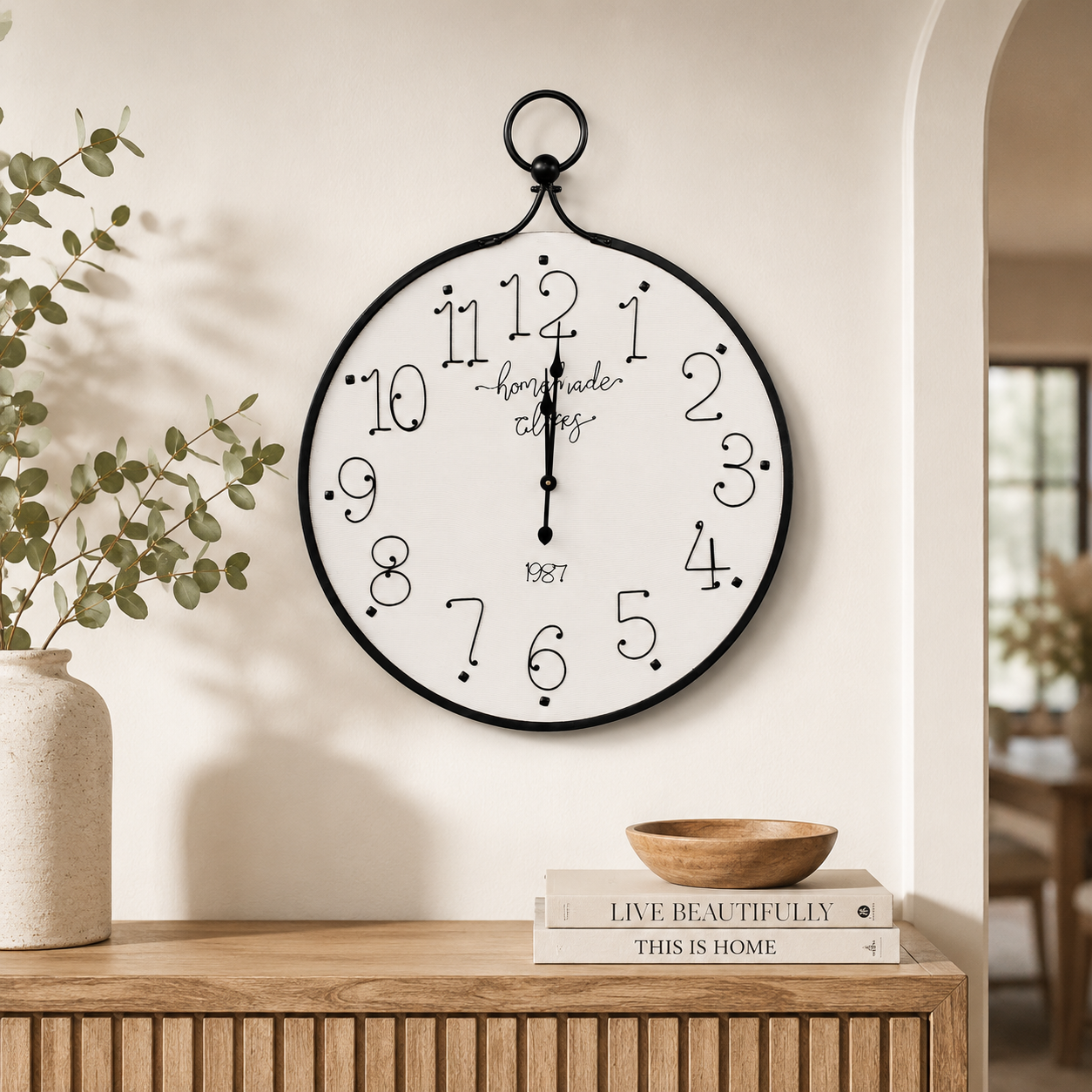 Large 100x80cm black and white iron clock with bold numerals, ideal for elegant feature walls and living spaces.