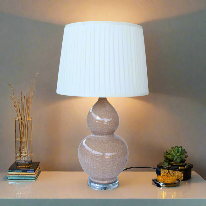 Unique Boys Interiors. Elegant Blush Marble Lamp Add a touch of sophistication to your home with this exquisite handmade lamp from Unique Boys Interiors. The marbled blush base and cream pleated shade combine to create a truly unique piece that will elevate any room's decor. The generous size of 72x40cm makes it a perfect statement piece, adding warmth and elegance to your lounge, bedroom, dining room, or reception area.
This stunning lamp is carefully crafted with attention. www.uniqueboys.co.za