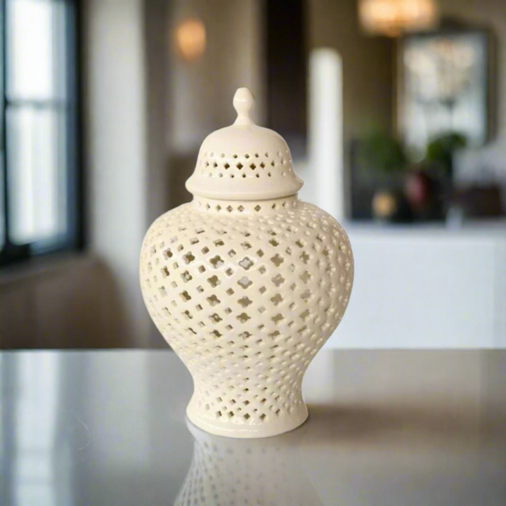 Elegant Decor: Medium White Cut-Out Ginger Jar
Add a touch of sophistication to your home decor with the Medium White Cut-Out Ginger Jar, a beautifully handcrafted piece that combines elegance and style. Measuring 38x22cm, this stunning jar features an intricate cut-out design that adds visual interest, texture, and dimension to any room. Its timeless white finish makes it a perfect fit for various decor styles, from modern to traditional.www.uniqueboys.co.za