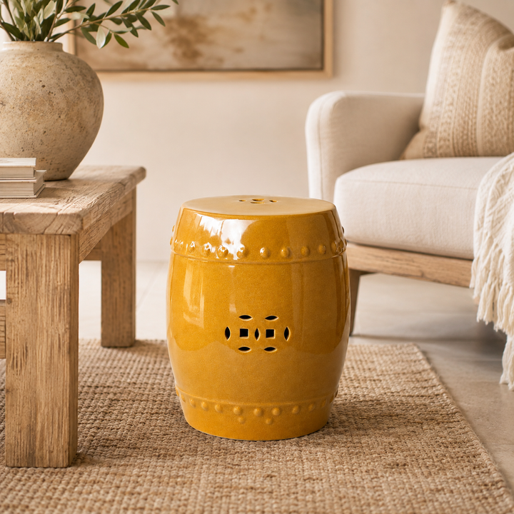 Elegant mustard glazed ceramic garden stool for stylish indoor and covered outdoor living spaces.