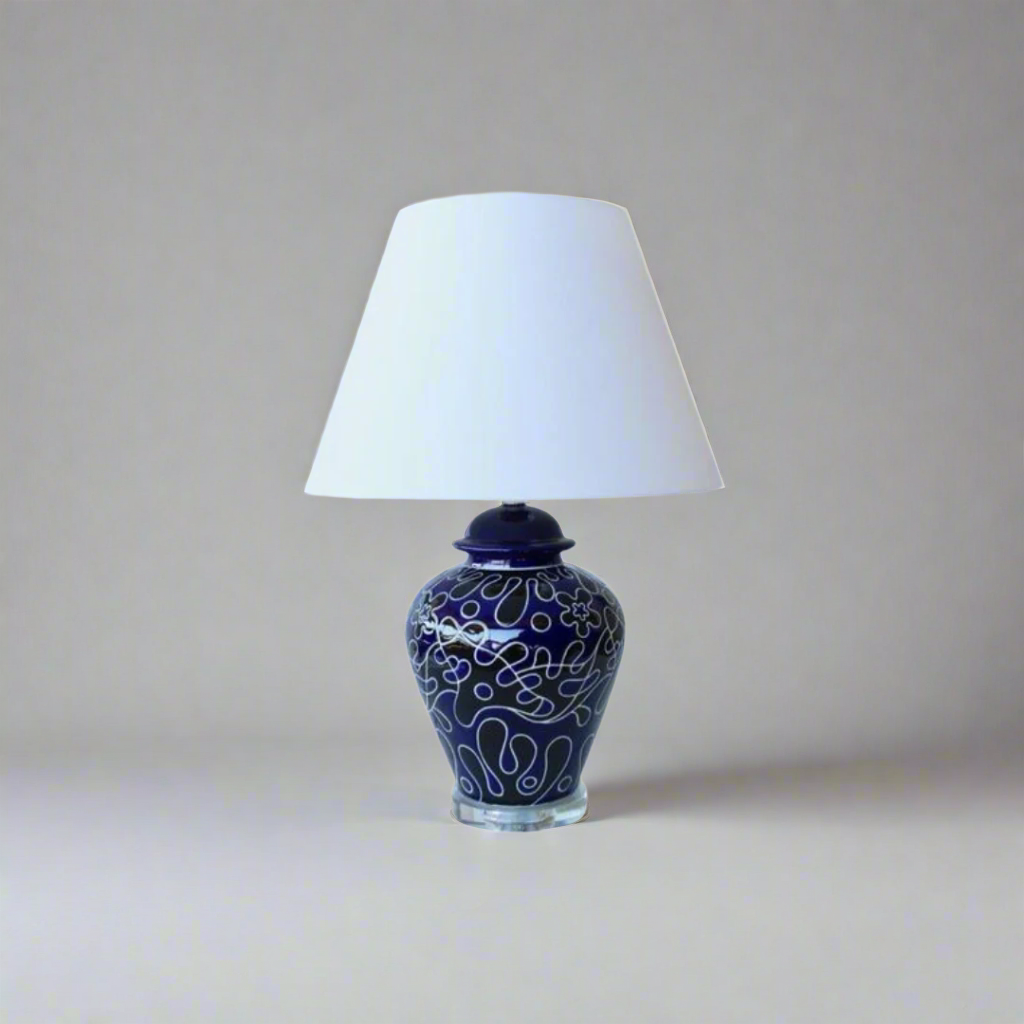 Luxury Navy & Black Lamp with Crystal Base
Elevate your home decor with this exquisite lamp from Unique Boys Interiors, showcasing a stunning crystal base and an elegant off-white shade. This masterpiece combines sophistication and modern style, perfect for adding a touch of luxury to any room. www.uniqueboys.co.za