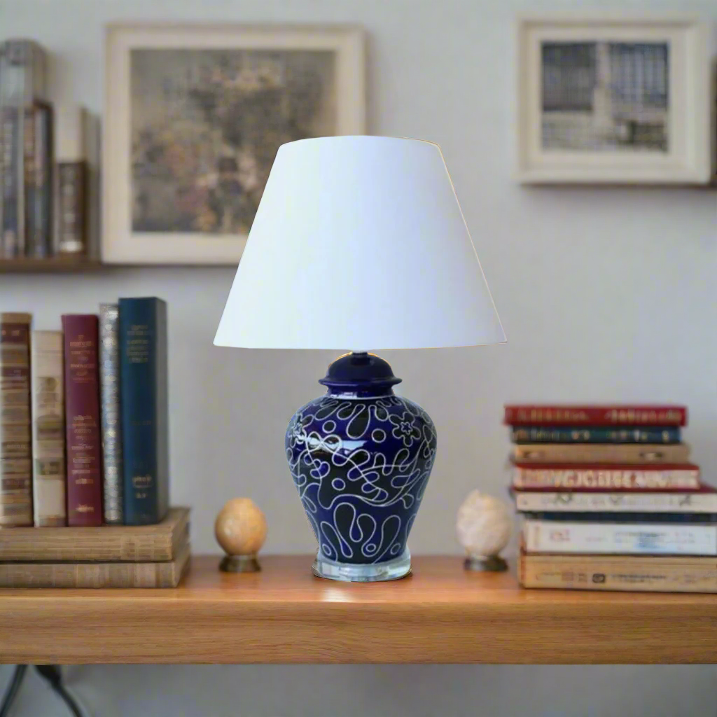 Luxury Navy & Black Lamp with Crystal Base
Elevate your home decor with this exquisite lamp from Unique Boys Interiors, showcasing a stunning crystal base and an elegant off-white shade. This masterpiece combines sophistication and modern style, perfect for adding a touch of luxury to any room. www.uniqueboys.co.za
