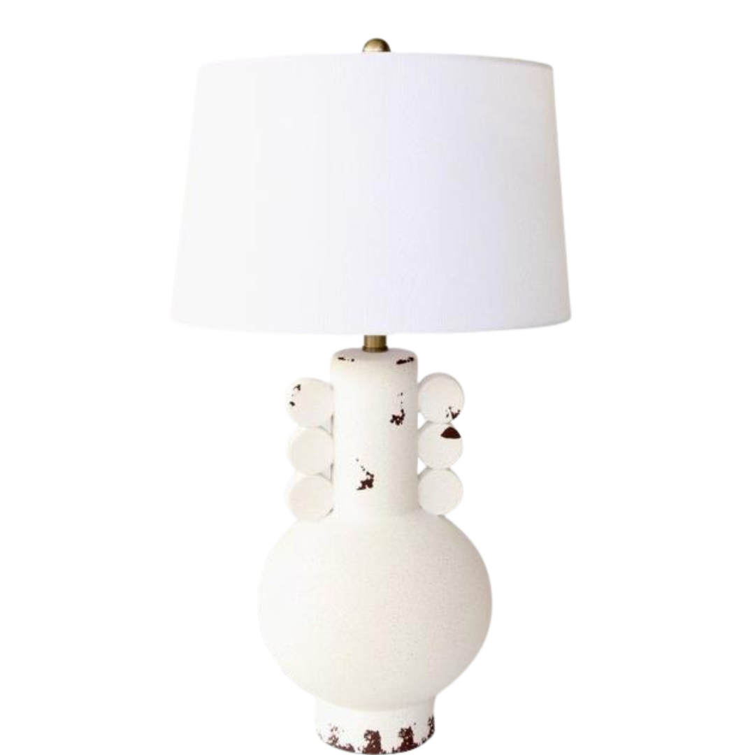 OFF WHITE DISTRESSED LAMP WHITE FINIAL &amp; HARP SHADE 69.5X41CM
Add a touch of vintage charm to your space with our Vintage-Chic Off-White Distressed Lamp. This beautifully crafted lamp features a distressed off-white finish that exudes nostalgic elegance, perfectly blending vintage style with modern functionality.
The stunning white finial and harp shade add a touch of sophistication, while the ample lighting provides the perfect ambiance for reading, relaxing, or working. Unique Boys.