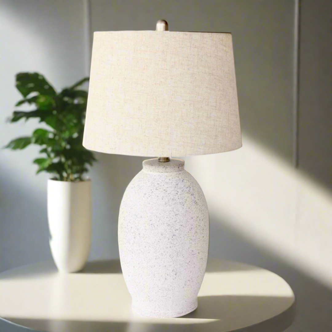 Off White Speckled Lamp Base Beige Linen Finial & lamp; Harp Shade 63X35cm. Warm up your space with the charming Off White Speckled Lamp Base. Its unique speckled design adds texture and visual interest, while the neutral beige linen finial and elegant harp shade bring a touch of sophistication to any room.Unique Boys.