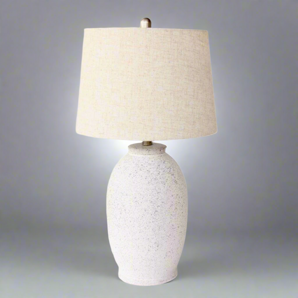 Off White Speckled Lamp Base Beige Linen Finial & lamp; Harp Shade 63X35cm. Warm up your space with the charming Off White Speckled Lamp Base. Its unique speckled design adds texture and visual interest, while the neutral beige linen finial and elegant harp shade bring a touch of sophistication to any room.Unique Boys.