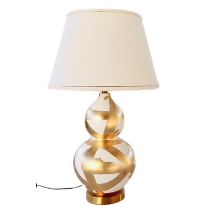 Off White &amp; Gold Painted Lamp Base With Gold Trim Shade 75X45cm
Elevate your home decor with our stunning Off White &amp; Gold Painted Lamp Base With Gold Trim Shade. This unique lamp features a beautifully painted off-white base paired with a luxurious gold trim shade, creating a sophisticated and elegant ambiance perfect for relaxing or entertaining. Measuring 75cm in height and 45cm in width, this lamp is perfectly sized for living rooms, bedrooms, or offices. Unique Boys.