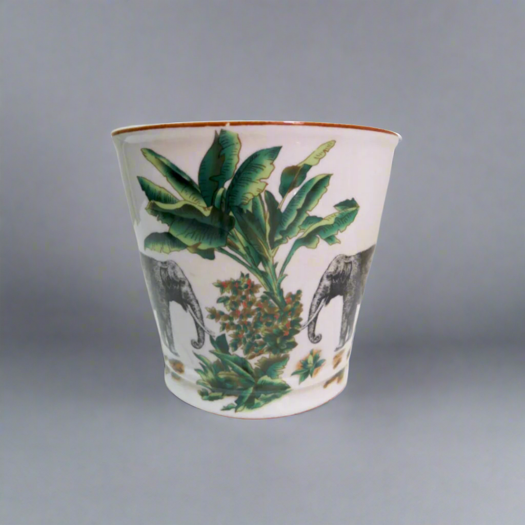 Origins Pot
Tropical Chic Decor Piece
Add a touch of exotic elegance to your home with this stunning Origins Pot. Crafted from high-quality porcelain, it features a vibrant pattern of elephants and palm trees that will transport you to a tropical paradise.
Key Features
Material: High-quality porcelain
Size: 15.5cm (Diameter) x 17cm (Height)
Design: Vibrant pattern of elephants and palm trees
Shop at: Unique Boys