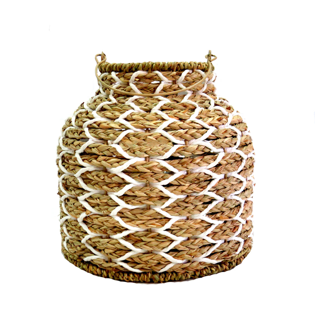  Sunset Strip Lantern
The Sunset Strip Lantern is expertly crafted with handwoven natural material rope, encircling a sturdy metal frame. The soft white accents in the weaving add a touch of elegance to this highly desirable lantern.