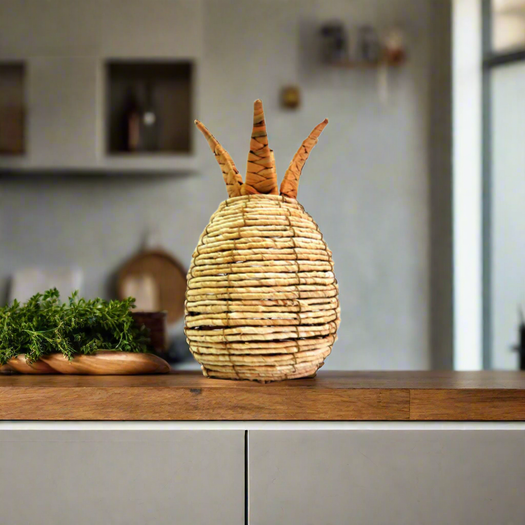 Bring a touch of the exotic into your home with Pineapple Panama, a stunning handwoven decorative piece. Expertly crafted onto a sturdy metal frame, this beautiful pineapple sculpture stands 28cm high with a circumference of 55cm.