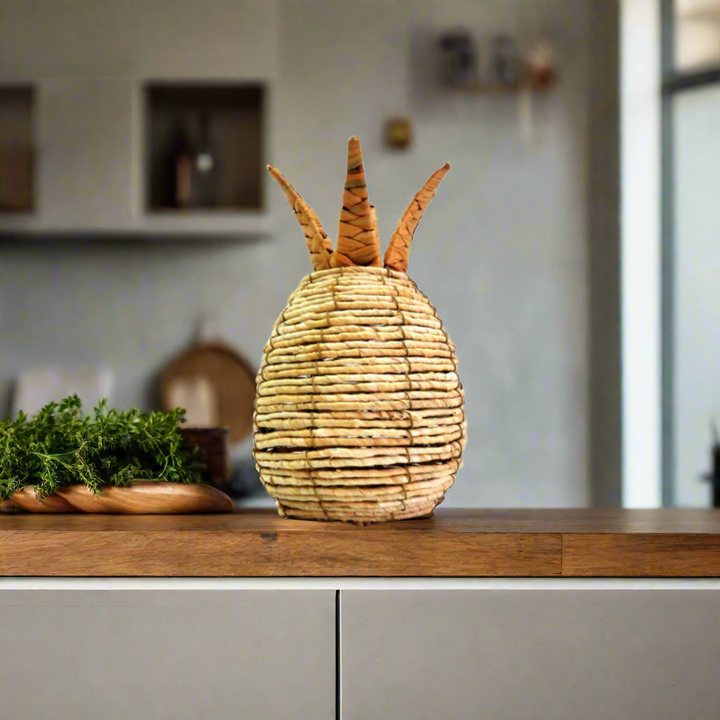 Bring a touch of the exotic into your home with Pineapple Panama, a stunning handwoven decorative piece. Expertly crafted onto a sturdy metal frame, this beautiful pineapple sculpture stands 28cm high with a circumference of 55cm.