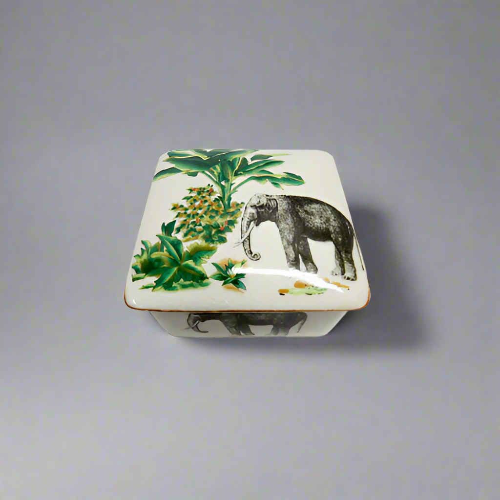 Palm Elephant Box
Unique Ceramic Decor Box
Add a touch of tropical charm to your home with this adorable Palm Elephant Box. Made from ceramic porcelain, it features a delightful square design with an elephant and palm trees.
Key Features
Material: Ceramic porcelain
Size: 11cm (Width) x 6cm (Height)
Design: Elephant and palm trees
Shop at: Unique Boys