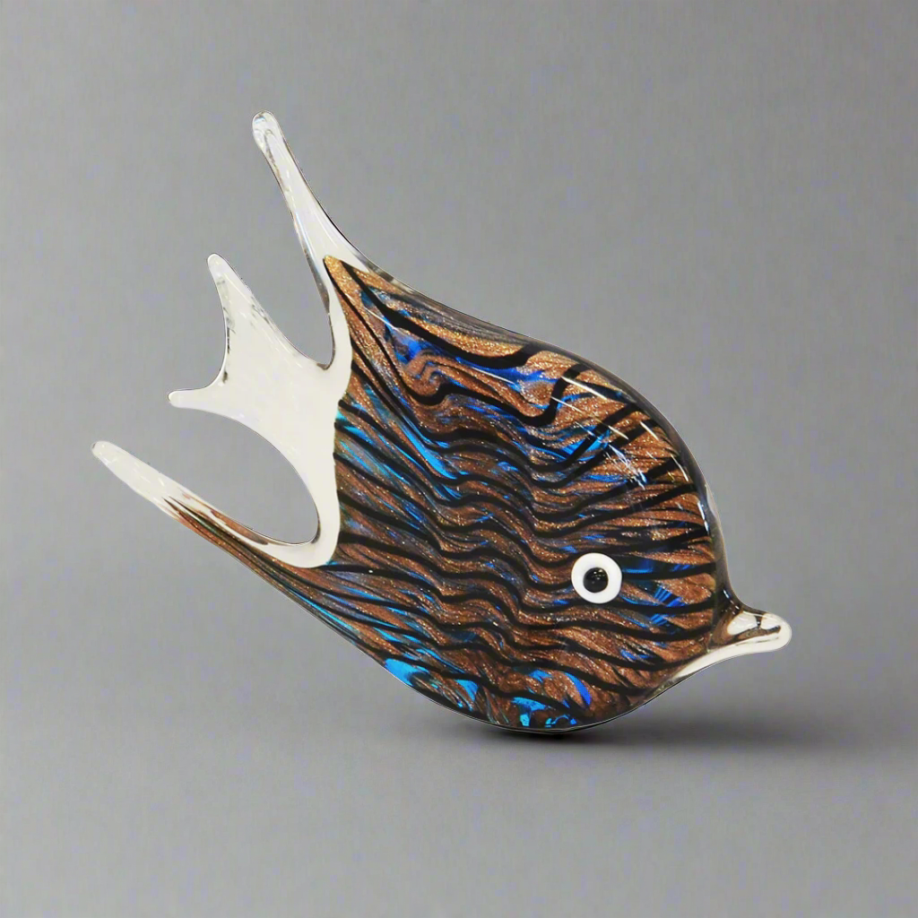 Paperweight Fish Zebra Agate - 22cm x 14cm
Elevate your interior space with the stunning Paperweight Fish Zebra Agate, a truly one-of-a-kind decoration crafted from premium quality speckled glass.
Design Features:
Size: 22cm x 14cm
Unique fish shape with zebra agate-inspired design
Speckled glass construction adds a touch of luxury and sophistication
Perfect for adding a bold statement to your living space
Interior Style:
Complements modern, bohemian, and eclectic interior styles
