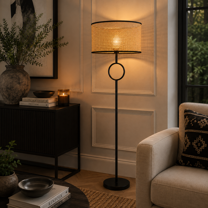 Add natural texture with the Pasquale Floor Lamp, featuring a woven shade and distinctive black circular detail.