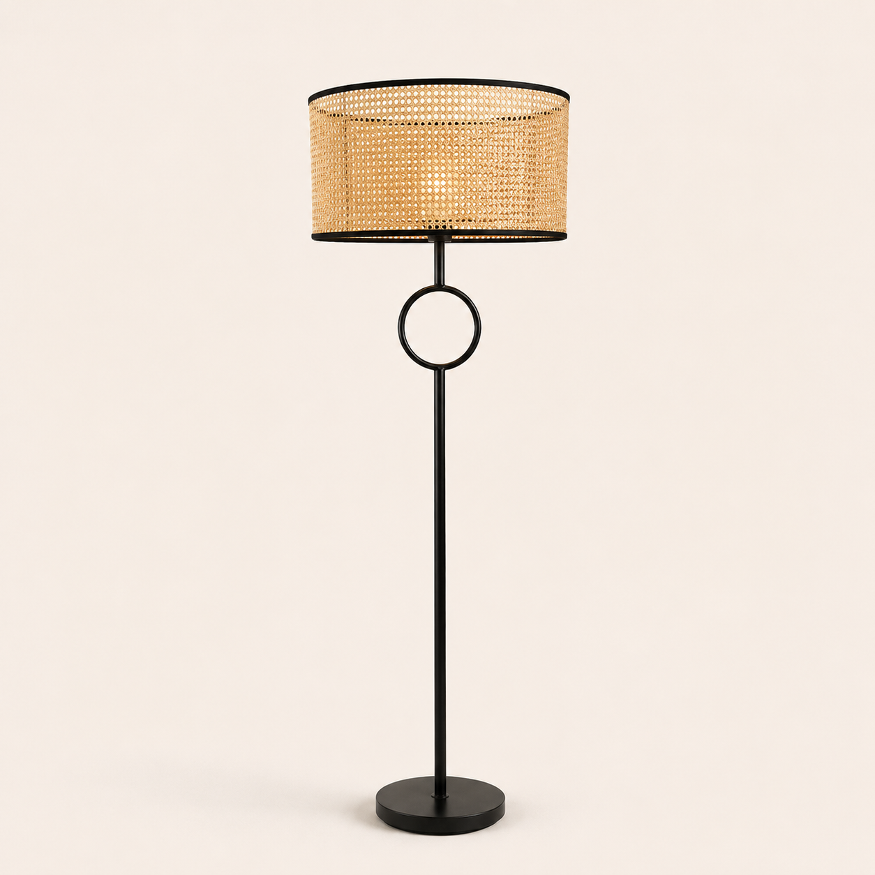 Pasquale Floor Lamp with a natural woven shade and sleek black frame, bringing warmth and elegance to interiors.