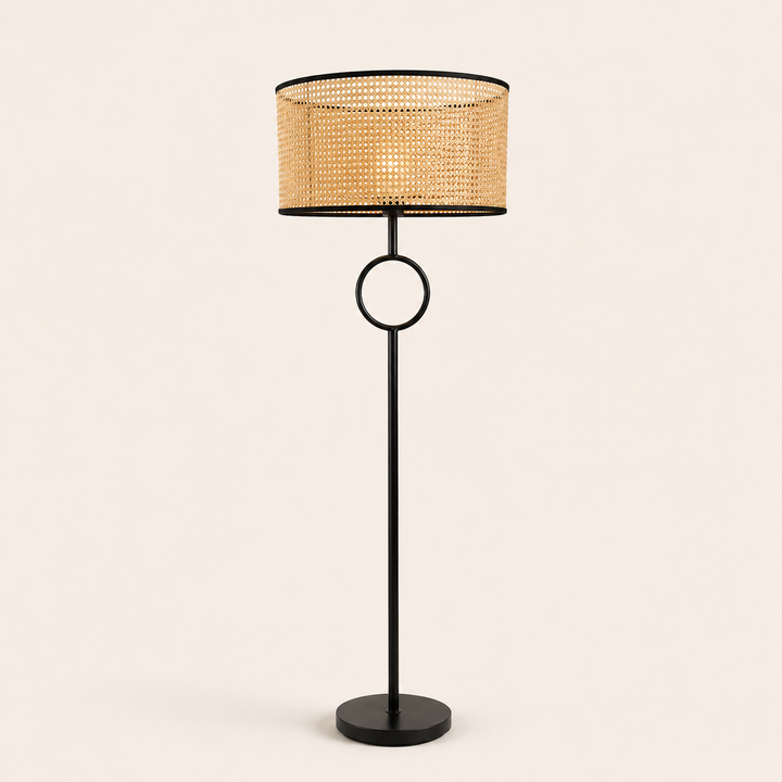 Pasquale Floor Lamp with a natural woven shade and sleek black frame, bringing warmth and elegance to interiors.