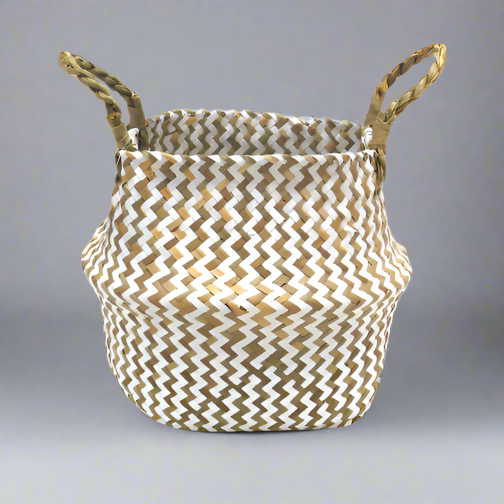 Product Details: Persell Basket
Description: A unique and beautifully finished basket featuring chevron weaving in white and natural colors.
Material: Natural fibers with twisted handles
Size: 22cm x 28cm x 24cm
Features:
Chevron weaving pattern
Natural twisted handles for a secure grip
Uses:
Outdoor decor: Add a touch of natural elegance to your patio, garden, or pool area.
Storage: Perfect for storing books, magazines, or other small items.
Store: Unique Boys, offering trendy decor that stays forever in s