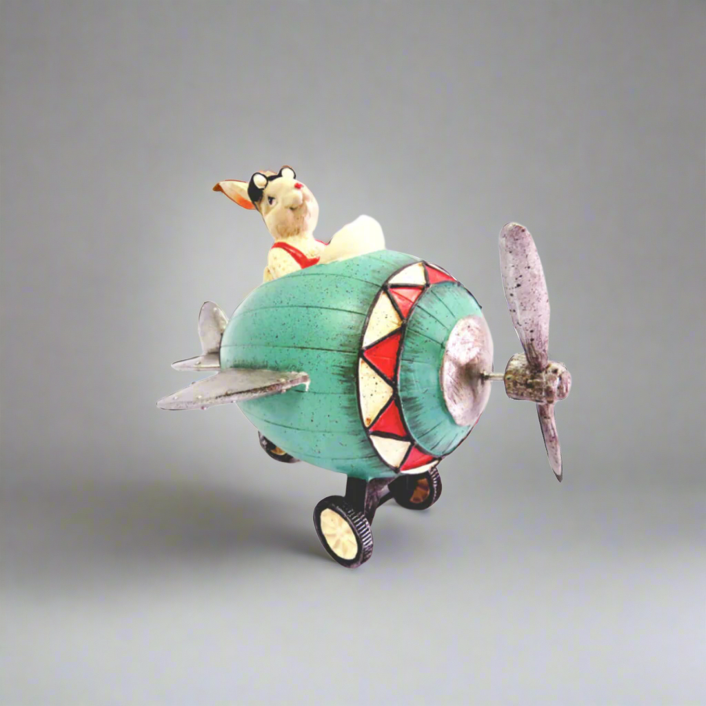 Maverick Rabbit
Product Description
Get ready for takeoff with the Maverick Rabbit! This charming, handcrafted figurine measures 24cm x 16.5cm x 17cm and features intricate details, including moving wheels and goggles. Its sturdy design makes it a delightful addition to any collection