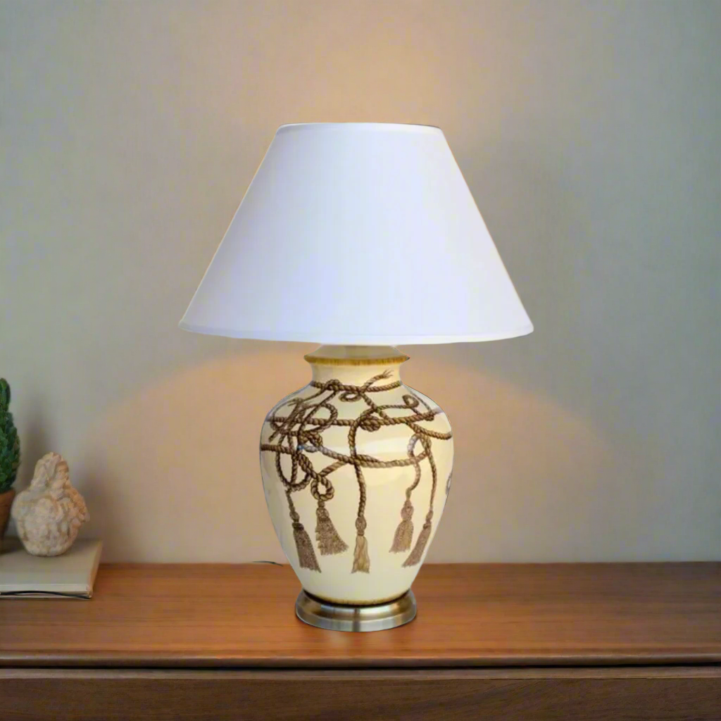 Rope Tassel Lamp with Off White Shade (70x50cm)
Elevate your home decor with this stylish Rope Tassel Lamp featuring an Off White Shade, measuring 70x50cm. The elegant rope tassel detail and soft off-white hue add a modern touch to any room, creating a warm and inviting atmosphere. This lamp is not only functional but also a beautiful piece of art, perfect for illuminating your lounge, bedroom, dining room, or reception area. www.uniqueboys.co.za