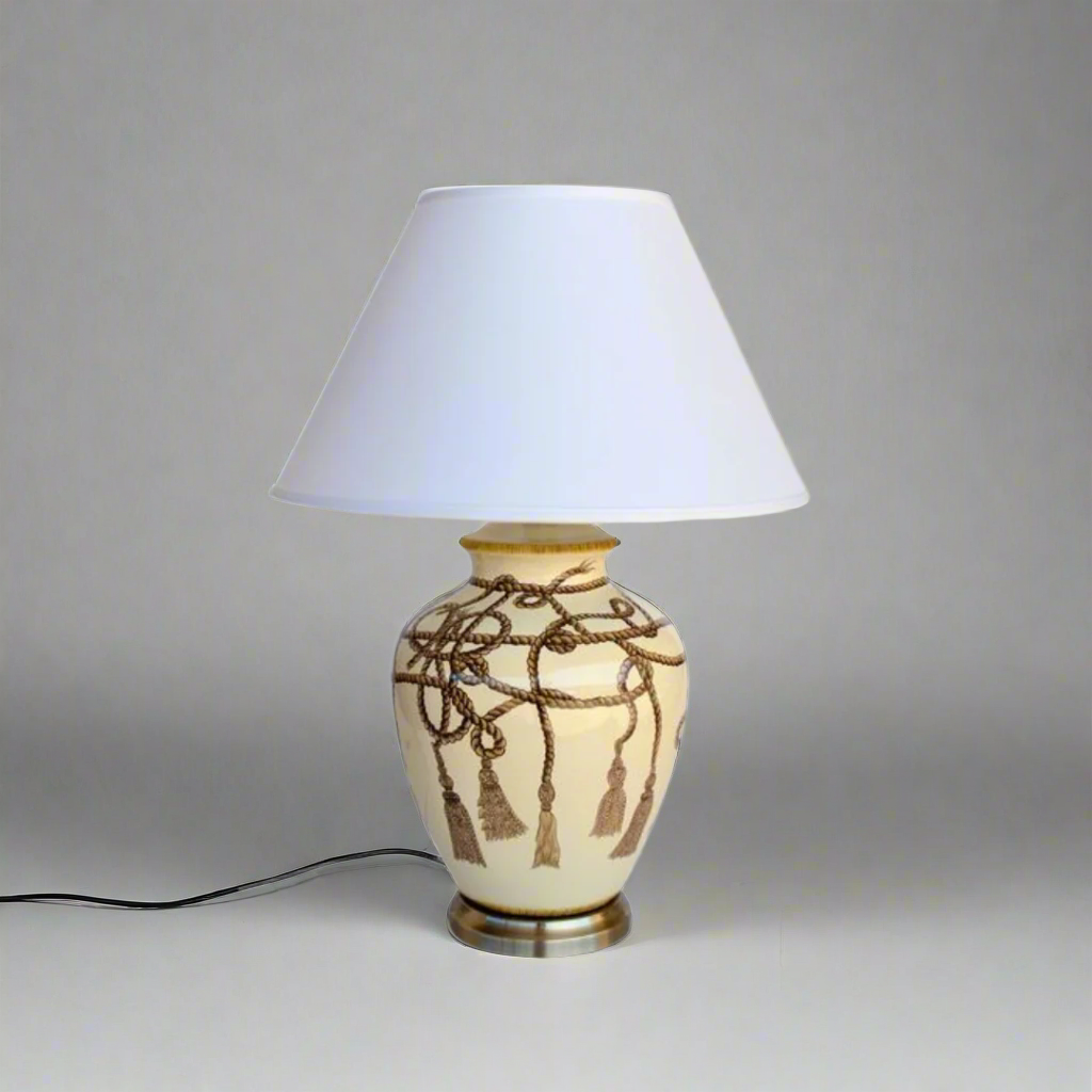 Rope Tassel Lamp with Off White Shade (70x50cm)
Elevate your home decor with this stylish Rope Tassel Lamp featuring an Off White Shade, measuring 70x50cm. The elegant rope tassel detail and soft off-white hue add a modern touch to any room, creating a warm and inviting atmosphere. This lamp is not only functional but also a beautiful piece of art, perfect for illuminating your lounge, bedroom, dining room, or reception area. www.uniqueboys.co.za