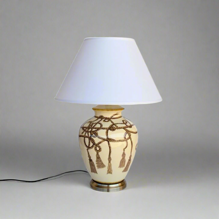 Rope Tassel Lamp with Off White Shade (70x50cm)
Elevate your home decor with this stylish Rope Tassel Lamp featuring an Off White Shade, measuring 70x50cm. The elegant rope tassel detail and soft off-white hue add a modern touch to any room, creating a warm and inviting atmosphere. This lamp is not only functional but also a beautiful piece of art, perfect for illuminating your lounge, bedroom, dining room, or reception area. www.uniqueboys.co.za