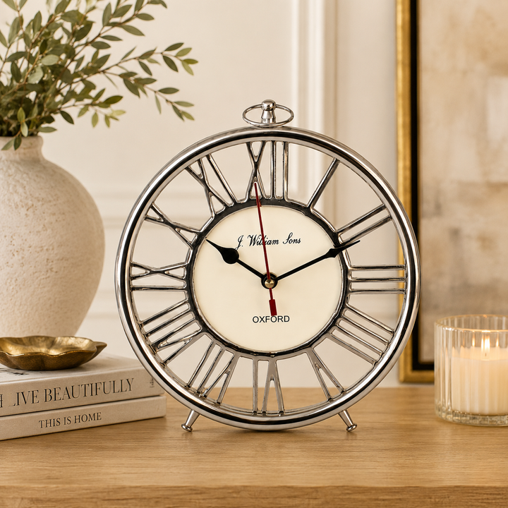 Shop the Round Silver Standing Table Clock 22x20cm, a sophisticated decorative accent for elegant interiors