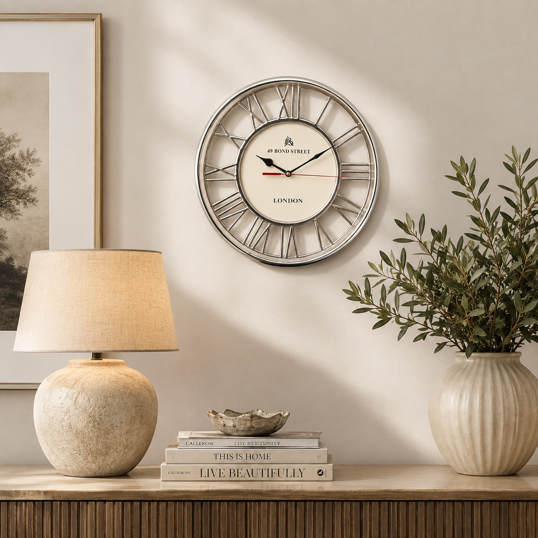 Elegant 30cm silver wall clock with an ivory face and Roman numeral frame for classic home décor.