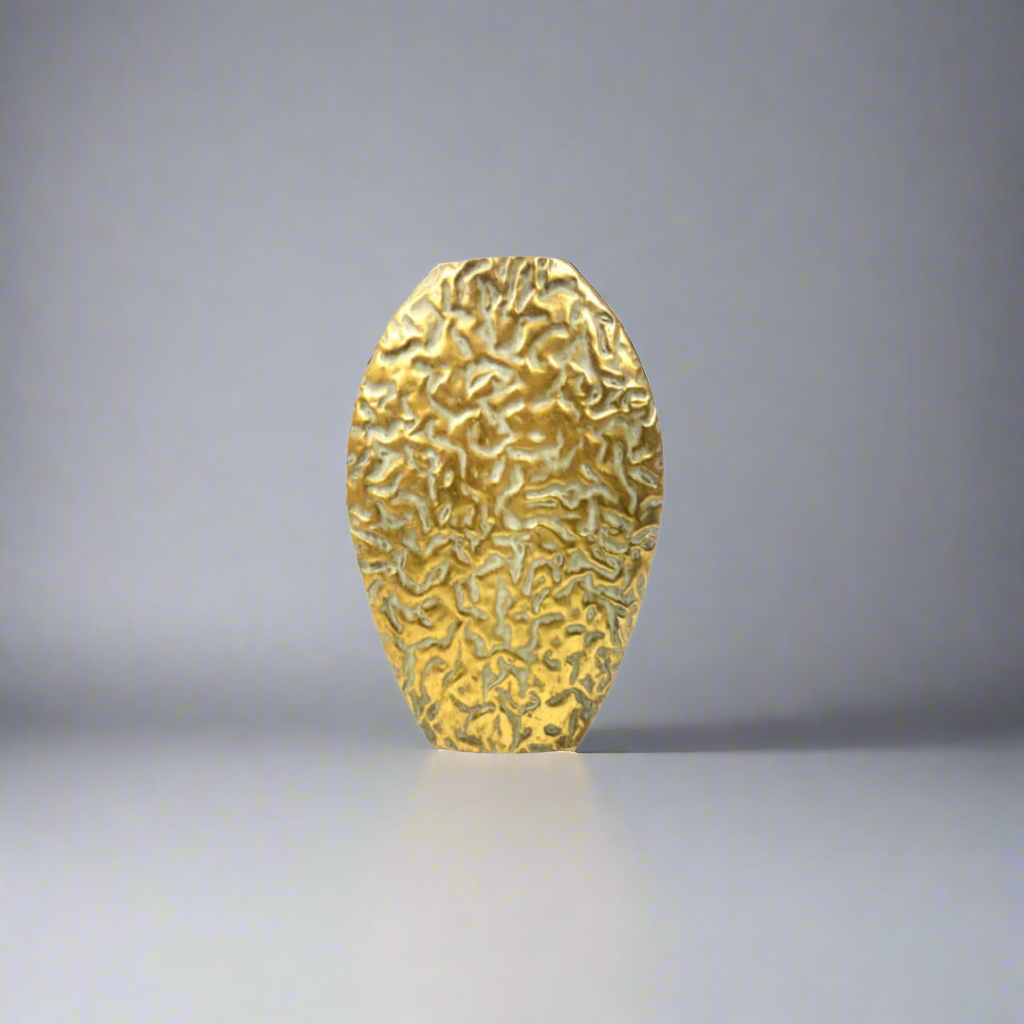 The Sanddance Vase
Add a touch of desert sophistication to your space with The Sanddance Vase. Crafted from metal with an antique gold coating, this vase features a unique texture that evokes the beauty of a sandstorm. Its substantial weight ensures stability, making it perfect for displaying your favorite flowers. unique boys 