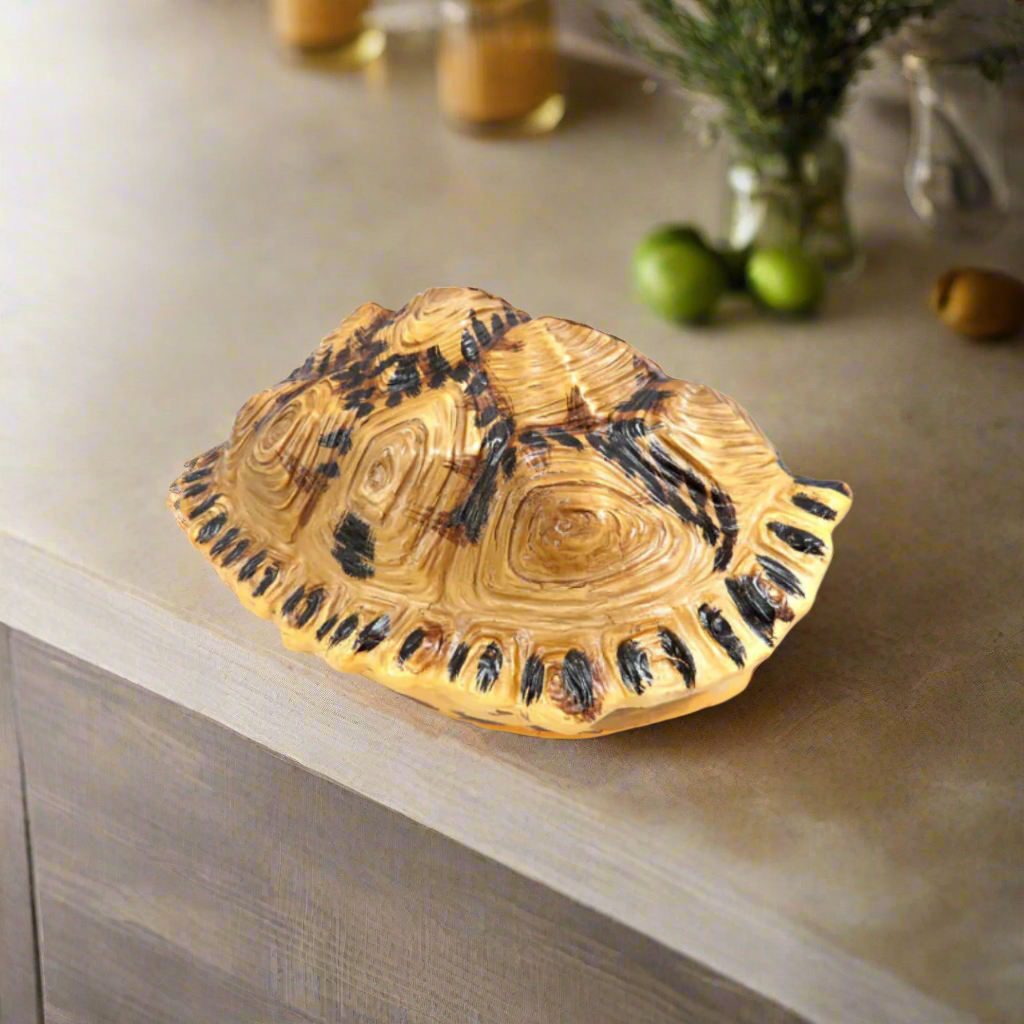 Introducing the Shyman Tortoise
Elegant and Versatile Decor for Your Home
Add a touch of elegance to your space with our beautifully crafted Shyman Tortoise. Measuring 21cm x 14cm x 28cm, this chunky, double-sided decor piece offers versatile display options - hang it up or use it as a stunning table centerpiece.
