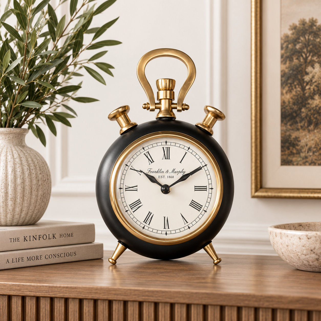 Add vintage charm with this Small Black & Brass Standing Clock, featuring classic Roman numeral detailing.