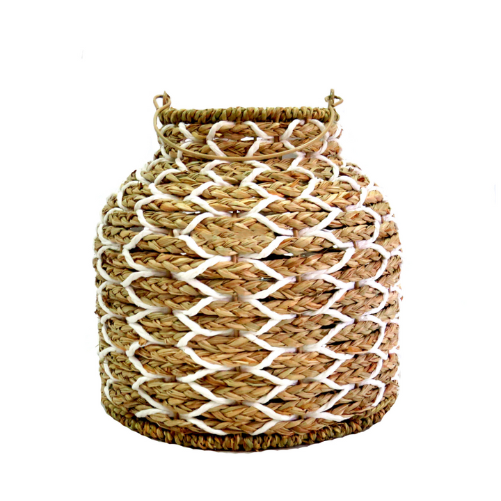 Sunset Strip Lantern
The Sunset Strip Lantern is expertly crafted with handwoven natural material rope, encircling a sturdy metal frame. The soft white accents in the weaving add a touch of elegance to this highly desirable lantern.