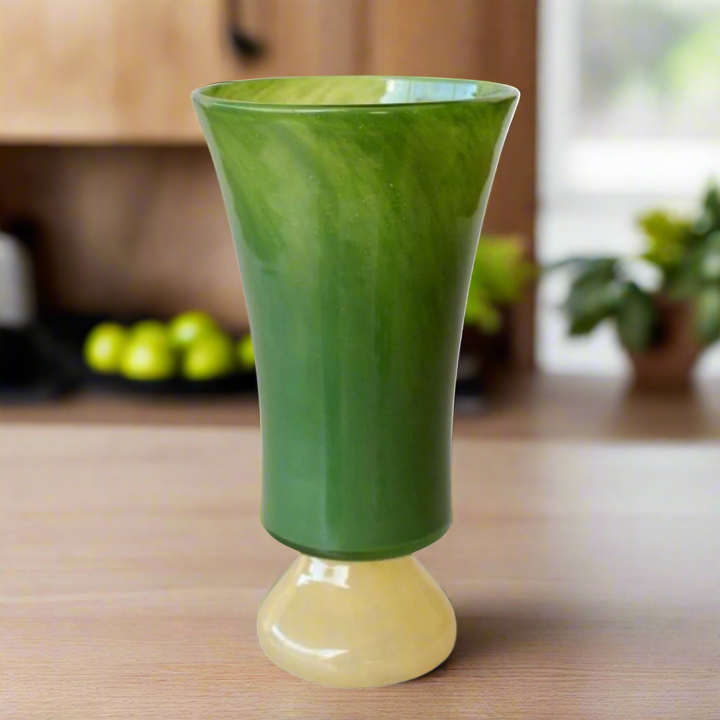 Tall Green &amp; Yellow Glass Vase with Unique Handles
Elevate your home decor with this stunning glass vase, featuring vibrant green and yellow hues and stylish handles. Perfect for adding a pop of color and sophistication to any room. Unique Boys.