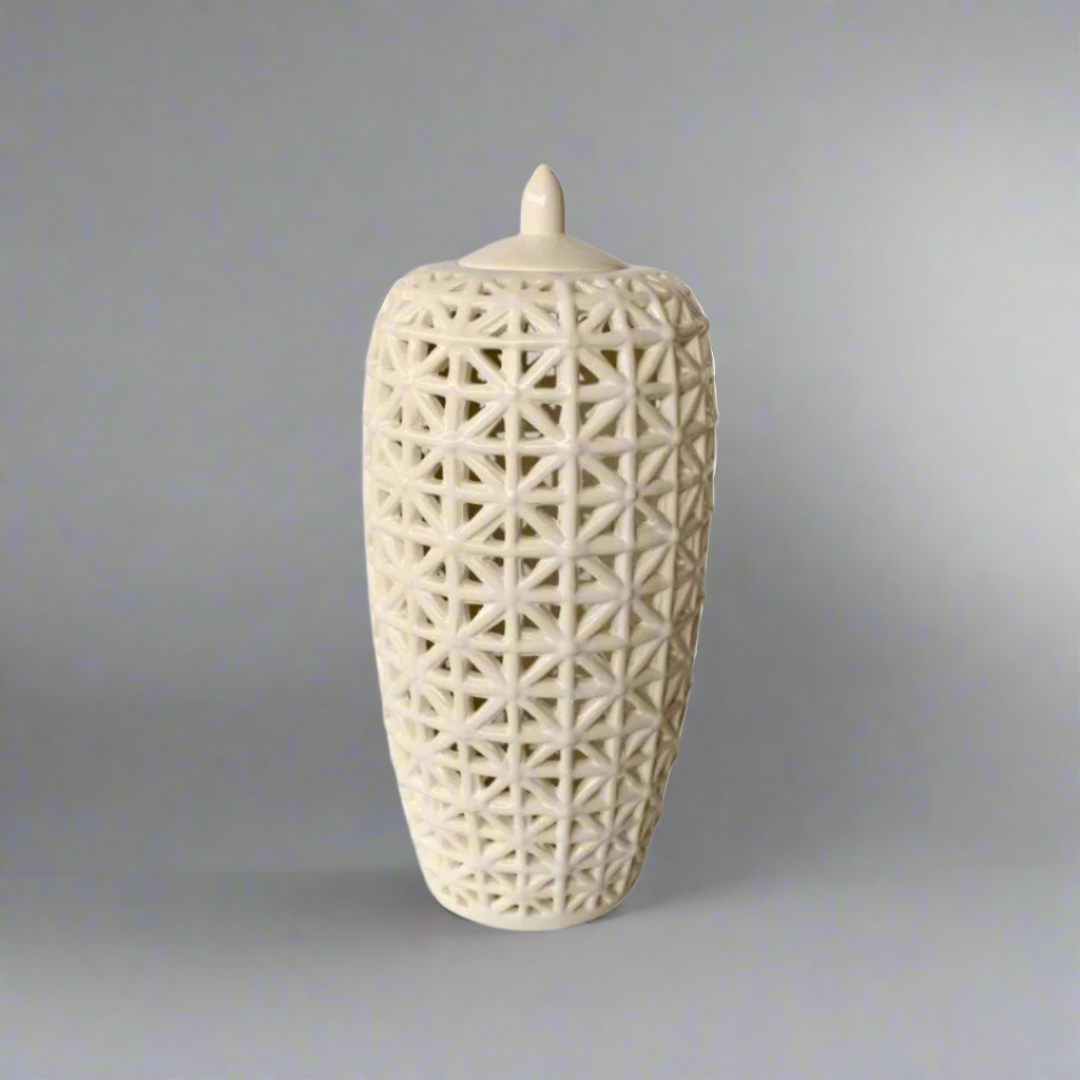 Elevate Your Space with Elegance
Discover the perfect blend of style and functionality with our stunning Tall White Criss Cross Cut-Out Jar with Lid. This beautifully crafted piece features a striking criss-cross design, adding depth and visual interest to any room. The timeless, glossy white finish makes it a versatile addition to various decor styles. Unique Boys.