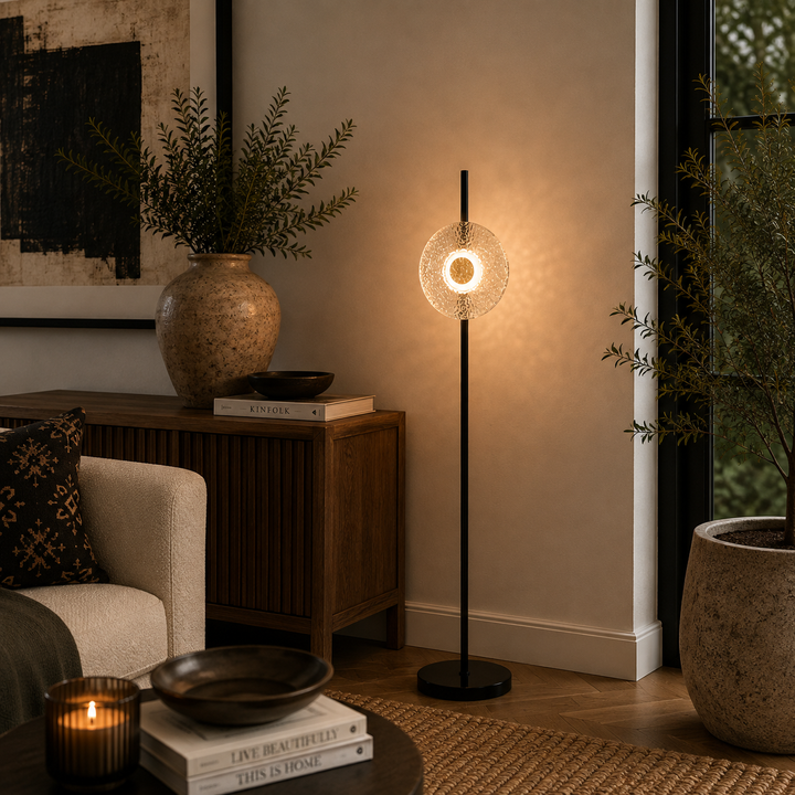 Titus Floor Lamp 1620mm high with a slim black frame and glowing glass detail for sophisticated interiors.
