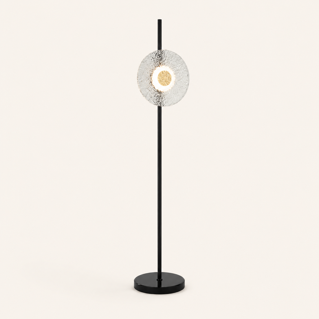 Create a stylish focal point with the Titus Floor Lamp, combining sculptural glass with modern black metal.