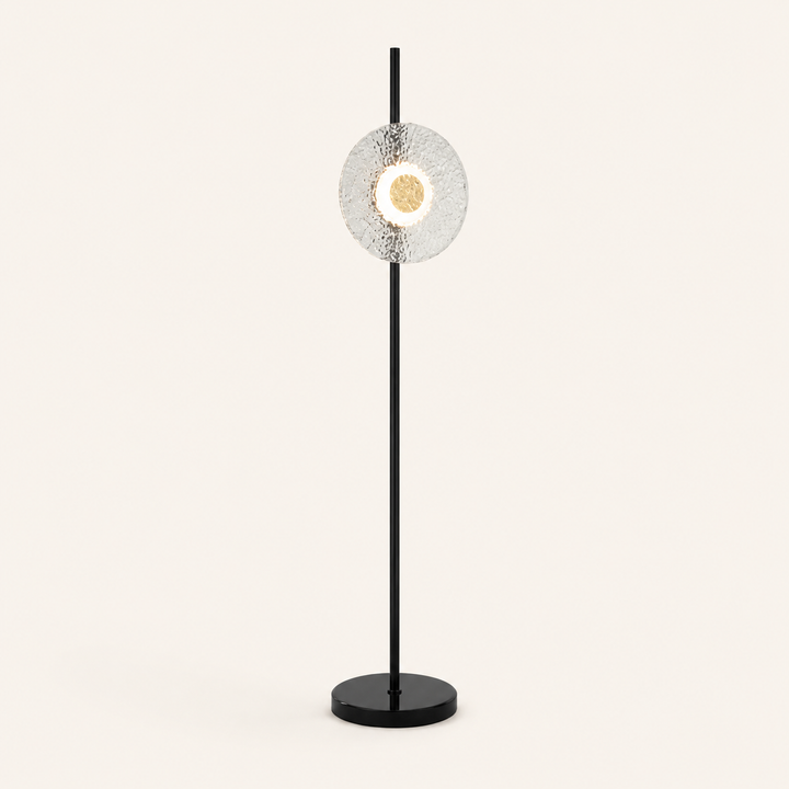 Create a stylish focal point with the Titus Floor Lamp, combining sculptural glass with modern black metal.