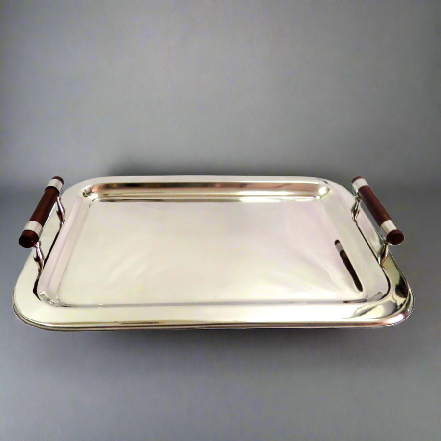 Elevate Your Serving Game with the Trade Off Tray
Expertly crafted with mirror-polished stainless steel, this stunning tray is perfect for any occasion. The Trade Off Tray measures 56cm in length and 40cm in width, providing ample space for serving drinks, appetizers, and more.