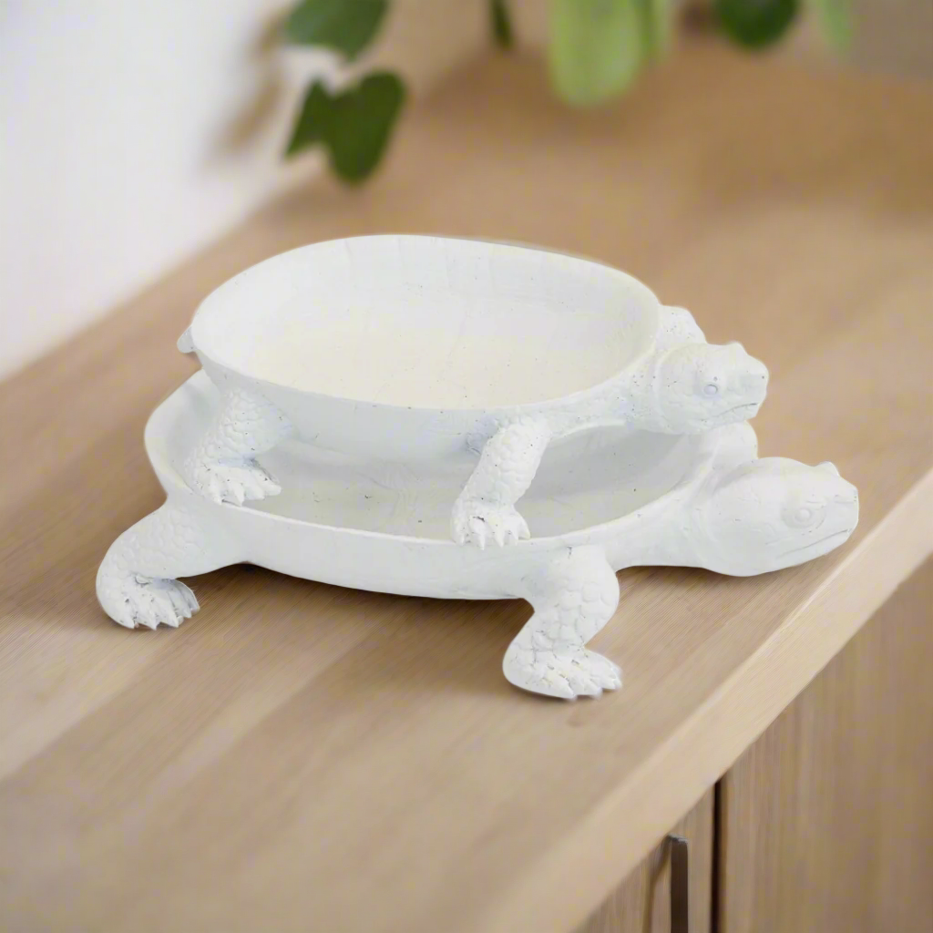 Turtle Platter Set of 2 - Resin
Elevate your table settings with the elegant Turtle Platter Set, expertly crafted from high-quality resin.
Design Features:
Set of 2 platters:
Large: 30cm (Length) x 18cm (Depth) x 5cm (Height)
Small: 24cm (Length) x 14cm (Depth) x 4cm (Height)
Turtle-inspired design adds a touch of whimsy and sophistication
Non-porous resin material ensures easy cleanup and durability
Entertaining Essentials:
Perfect for serving multiple dishes at once
Ideal for everyday use.