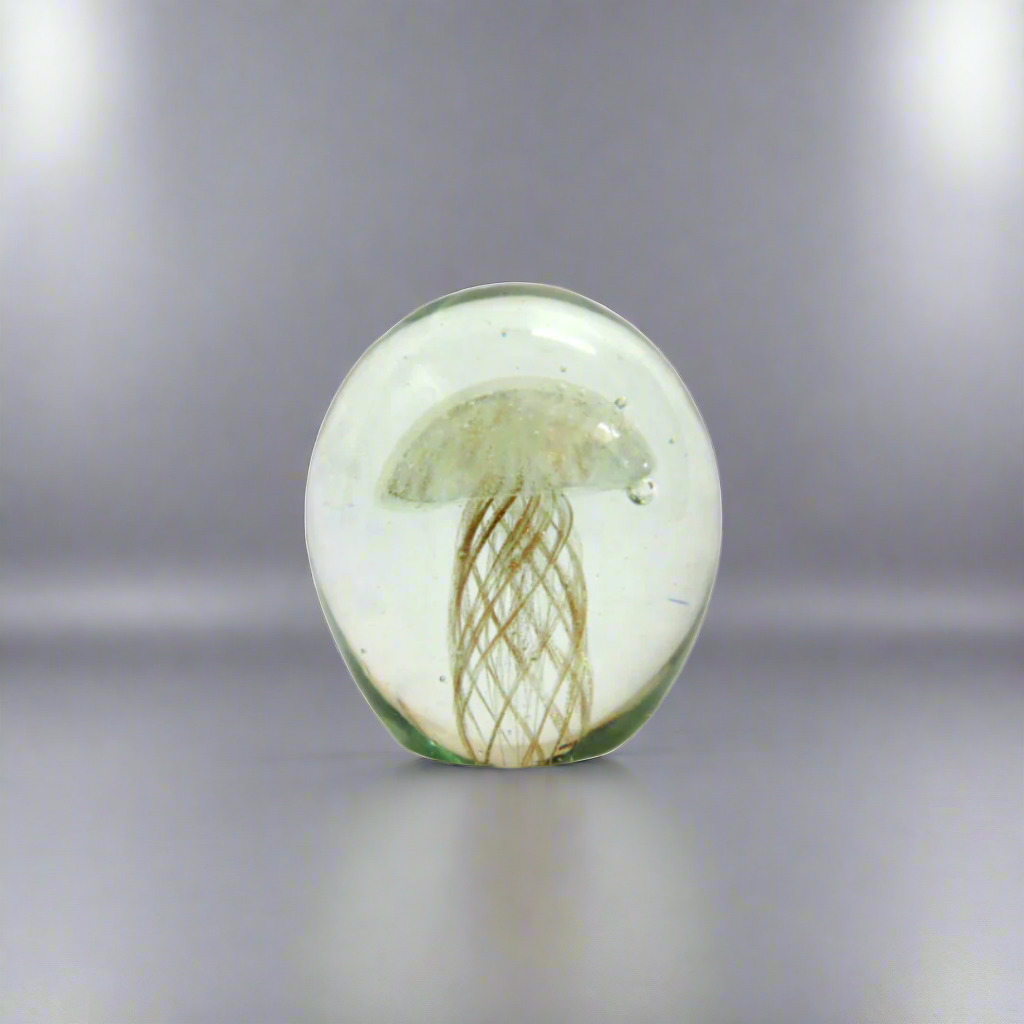 Unicornia Glass Orb
Discover the magic of Unicornia with this stunning glass orb. Handmade and heavy, it features a mesmerizing golden jellyfish with copper tentacles inside. Admire its intricate details and unique composition.