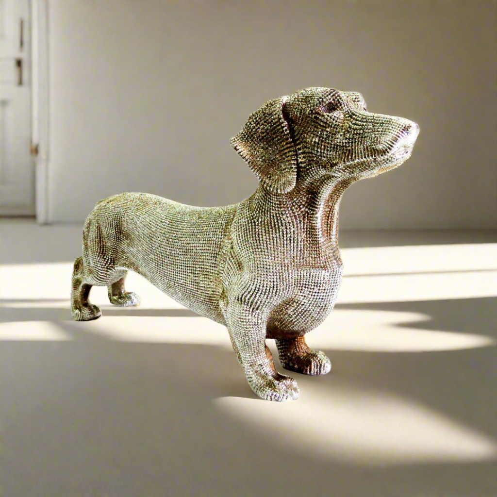 Unique Boys
Coco Sausage Dog
Silver Sausage Dog Figurine
Bring a touch of whimsy and elegance to your space with our charming Coco Sausage Dog