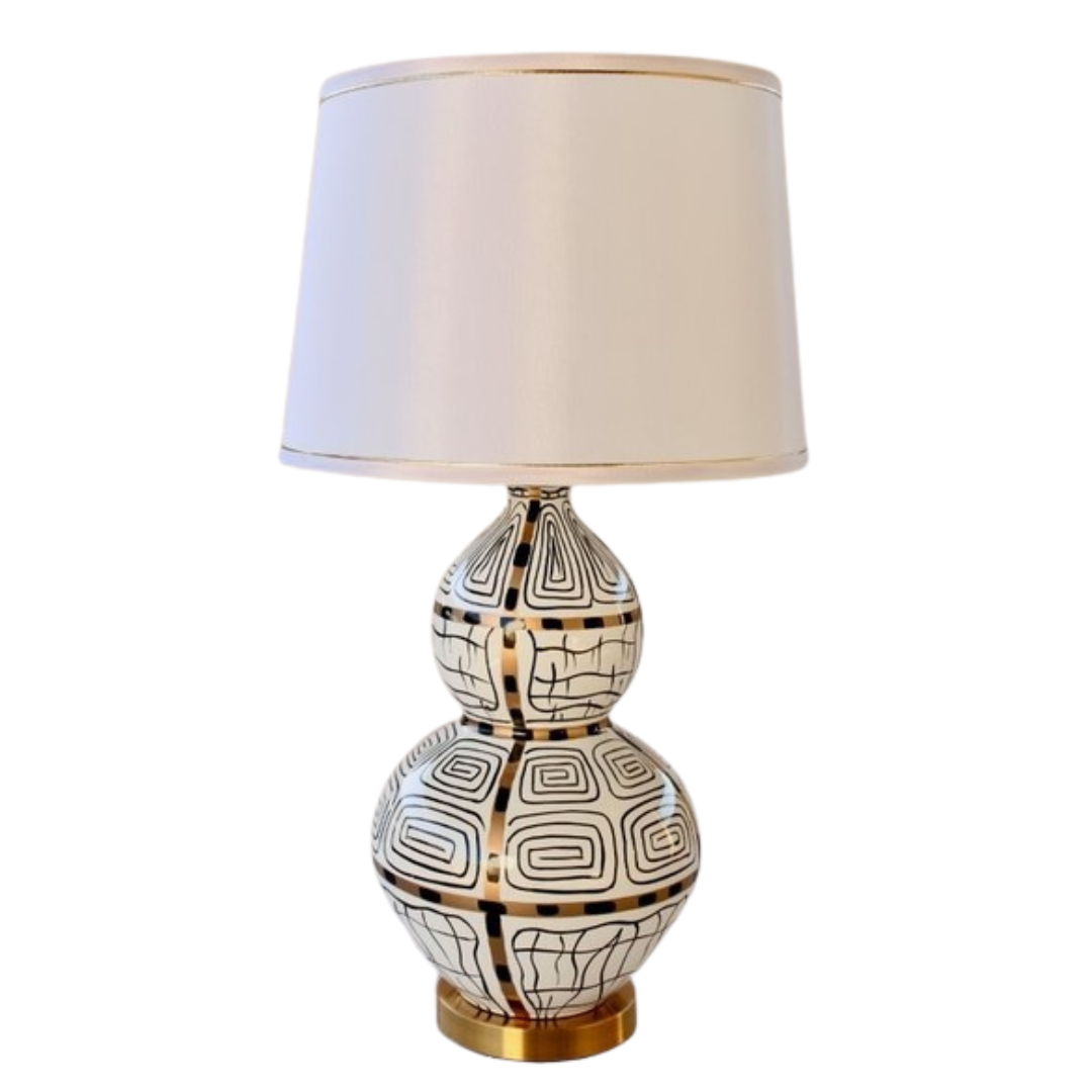 White, Black &amp; Gold Squiggle Lamp With Gold Trim Shade 83X40cm
Elevate your home decor with our stunning White, Black &amp; Gold Squiggle Lamp, featuring a sleek and sophisticated design that's sure to make a statement. This unique lamp boasts a gold trim shade that adds a touch of luxury to any room, creating a warm and inviting ambiance perfect for relaxing or entertaining. Measuring 83cm in height and 40cm in width, this lamp is perfectly sized for living rooms, bedrooms, or offices. Unique Boys.