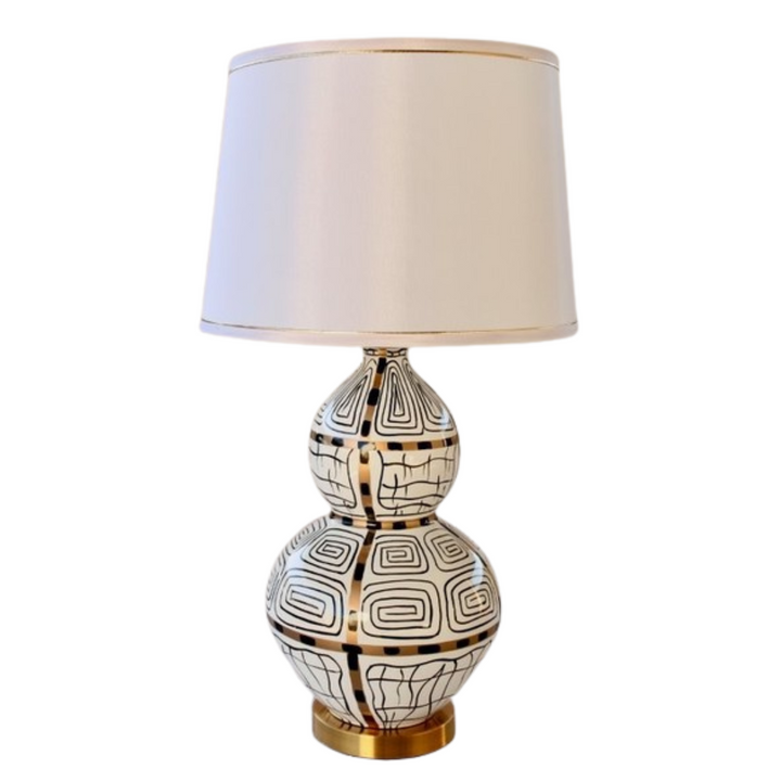 White, Black &amp; Gold Squiggle Lamp With Gold Trim Shade 83X40cm
Elevate your home decor with our stunning White, Black &amp; Gold Squiggle Lamp, featuring a sleek and sophisticated design that's sure to make a statement. This unique lamp boasts a gold trim shade that adds a touch of luxury to any room, creating a warm and inviting ambiance perfect for relaxing or entertaining. Measuring 83cm in height and 40cm in width, this lamp is perfectly sized for living rooms, bedrooms, or offices. Unique Boys.