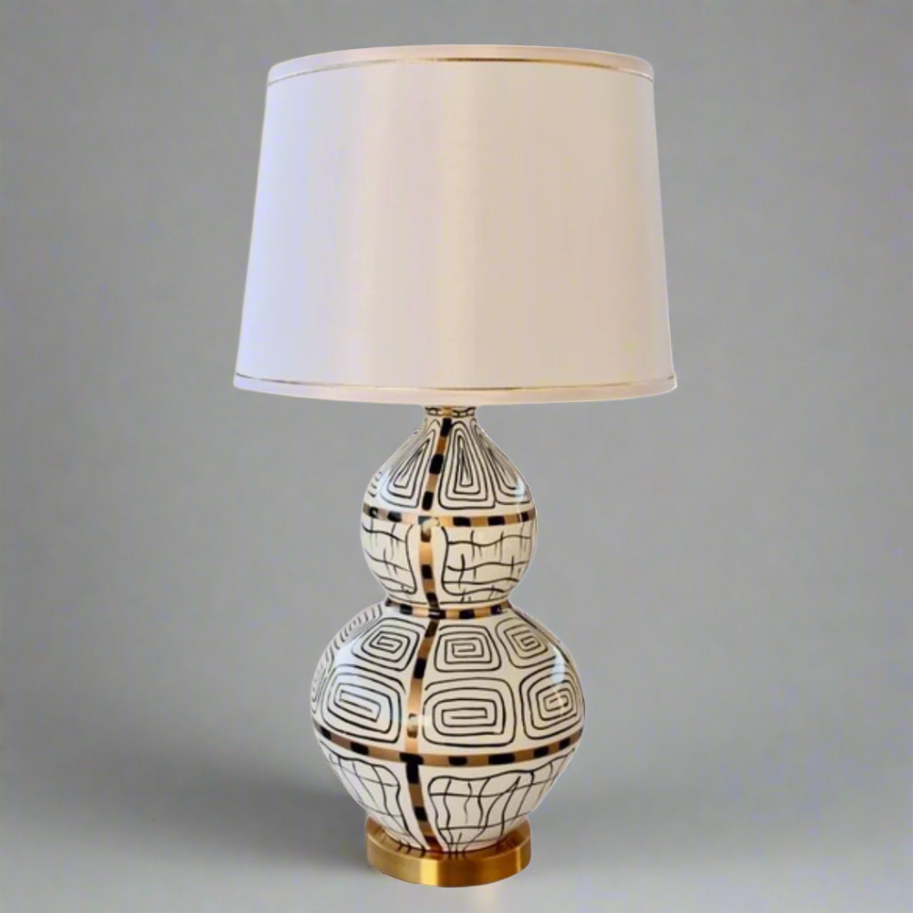White, Black &amp; Gold Squiggle Lamp With Gold Trim Shade 83X40cm
Elevate your home decor with our stunning White, Black &amp; Gold Squiggle Lamp, featuring a sleek and sophisticated design that's sure to make a statement. This unique lamp boasts a gold trim shade that adds a touch of luxury to any room, creating a warm and inviting ambiance perfect for relaxing or entertaining. Measuring 83cm in height and 40cm in width, this lamp is perfectly sized for living rooms, bedrooms, or offices. Unique Boys.