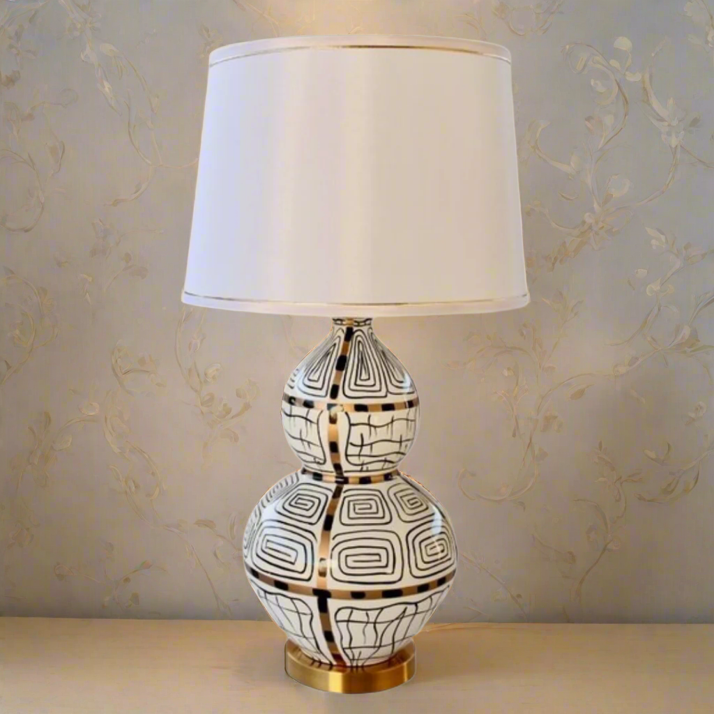 White, Black &amp; Gold Squiggle Lamp With Gold Trim Shade 83X40cm
Elevate your home decor with our stunning White, Black &amp; Gold Squiggle Lamp, featuring a sleek and sophisticated design that's sure to make a statement. This unique lamp boasts a gold trim shade that adds a touch of luxury to any room, creating a warm and inviting ambiance perfect for relaxing or entertaining. Measuring 83cm in height and 40cm in width, this lamp is perfectly sized for living rooms, bedrooms, or offices. Unique Boys.