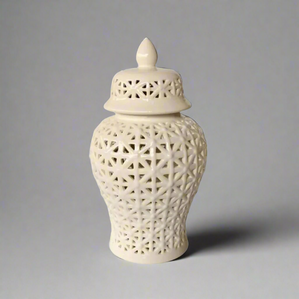 Sophisticated Elegance: White Criss Cross Cut-Out Ginger Jar Elevate your home decor with the exquisite White Criss Cross Cut-Out Ginger Jar, a masterpiece of elegance and refinement. Handcrafted to perfection, this stunning piece measures 41cm x 22cm and boasts an intricate criss-cross cut-out design that adds visual interest and sophistication to any room. The glossy white finish is both timeless and versatile, seamlessly complementing various decor styles.
Product Highlights, 41cm x 22cm. Unique Boys.