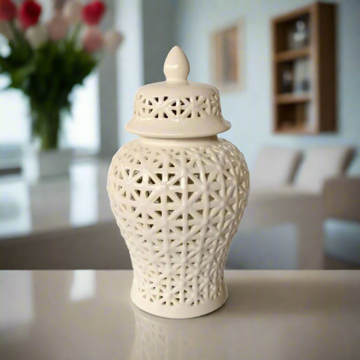 Sophisticated Elegance: White Criss Cross Cut-Out Ginger Jar Elevate your home decor with the exquisite White Criss Cross Cut-Out Ginger Jar, a masterpiece of elegance and refinement. Handcrafted to perfection, this stunning piece measures 41cm x 22cm and boasts an intricate criss-cross cut-out design that adds visual interest and sophistication to any room. The glossy white finish is both timeless and versatile, seamlessly complementing various decor styles.
Product Highlights, 41cm x 22cm. Unique Boys.