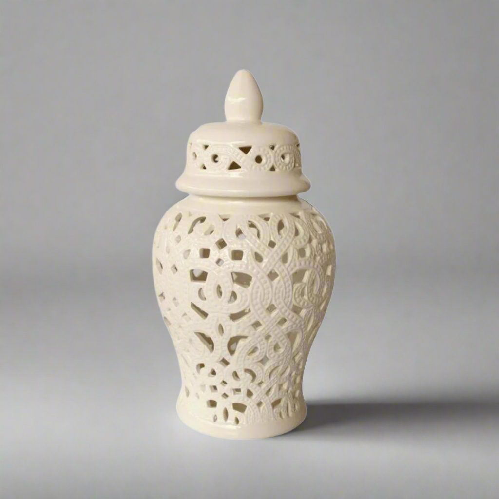 Elegant Sophistication: White Cut-Out Ginger Jar with Braided Design
Add a touch of refined elegance to your home decor with the White Cut-Out Ginger Jar featuring a beautiful braided design. Measuring 47x22cm, this stunning piece is expertly handcrafted with high-quality materials, ensuring durability and a luxurious finish. The intricate braided cut-out design adds visual interest and texture, while the glossy white finish provides a sophisticated and timeless look.uniqueboys.