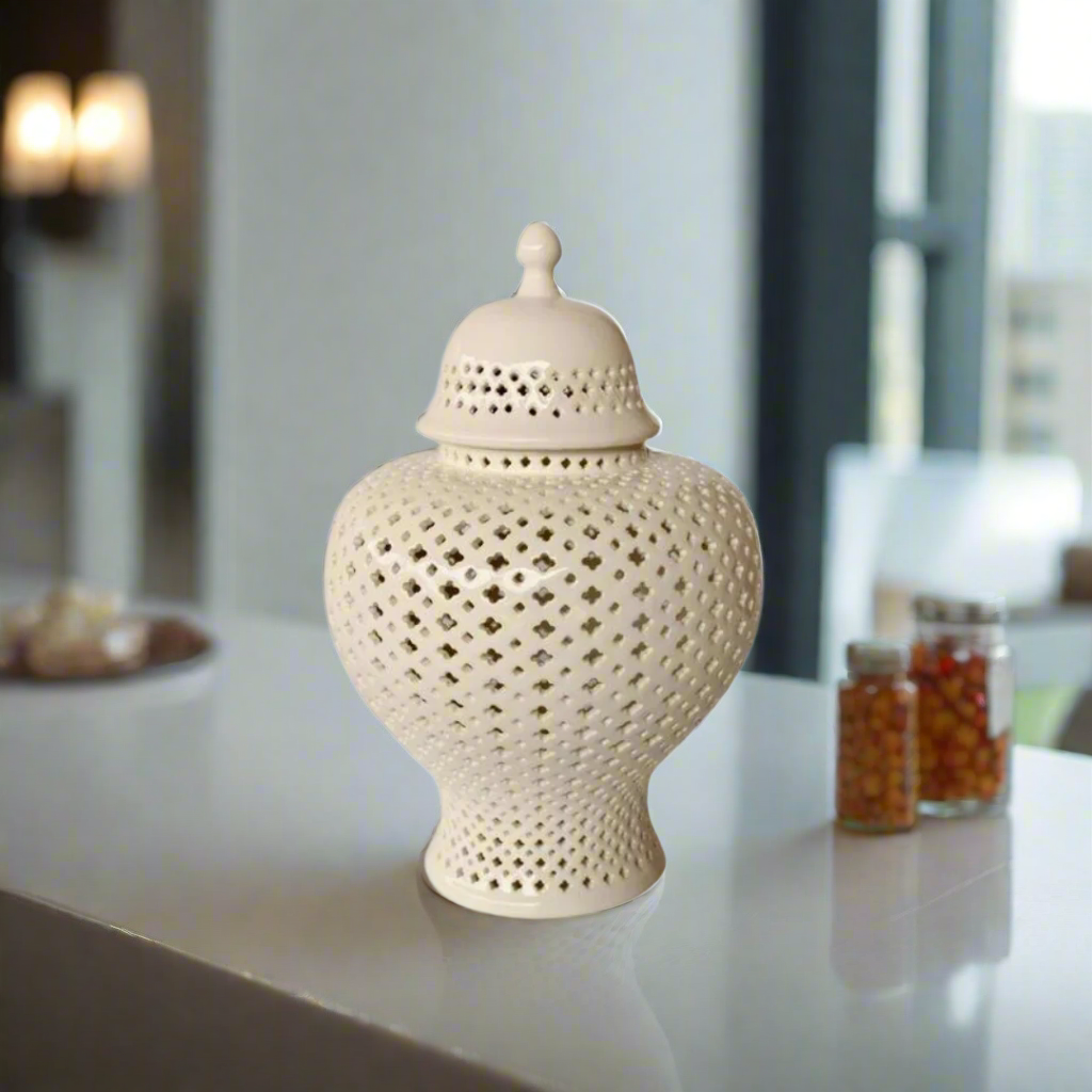 Make a Statement with Elegance: White Extra Large Fat Cut-Out Ginger Jar
Elevate your space with the majestic White Extra Large Fat Cut-Out Ginger Jar, a stunning piece that embodies elegance and sophistication. Measuring 49x30cm, this extra-large jar is expertly handcrafted with high-quality materials, ensuring durability and longevity. Its beautiful cut-out design and glossy white finish add a touch of refinement, making it a perfect fit for various decor styles. Unique Boys.