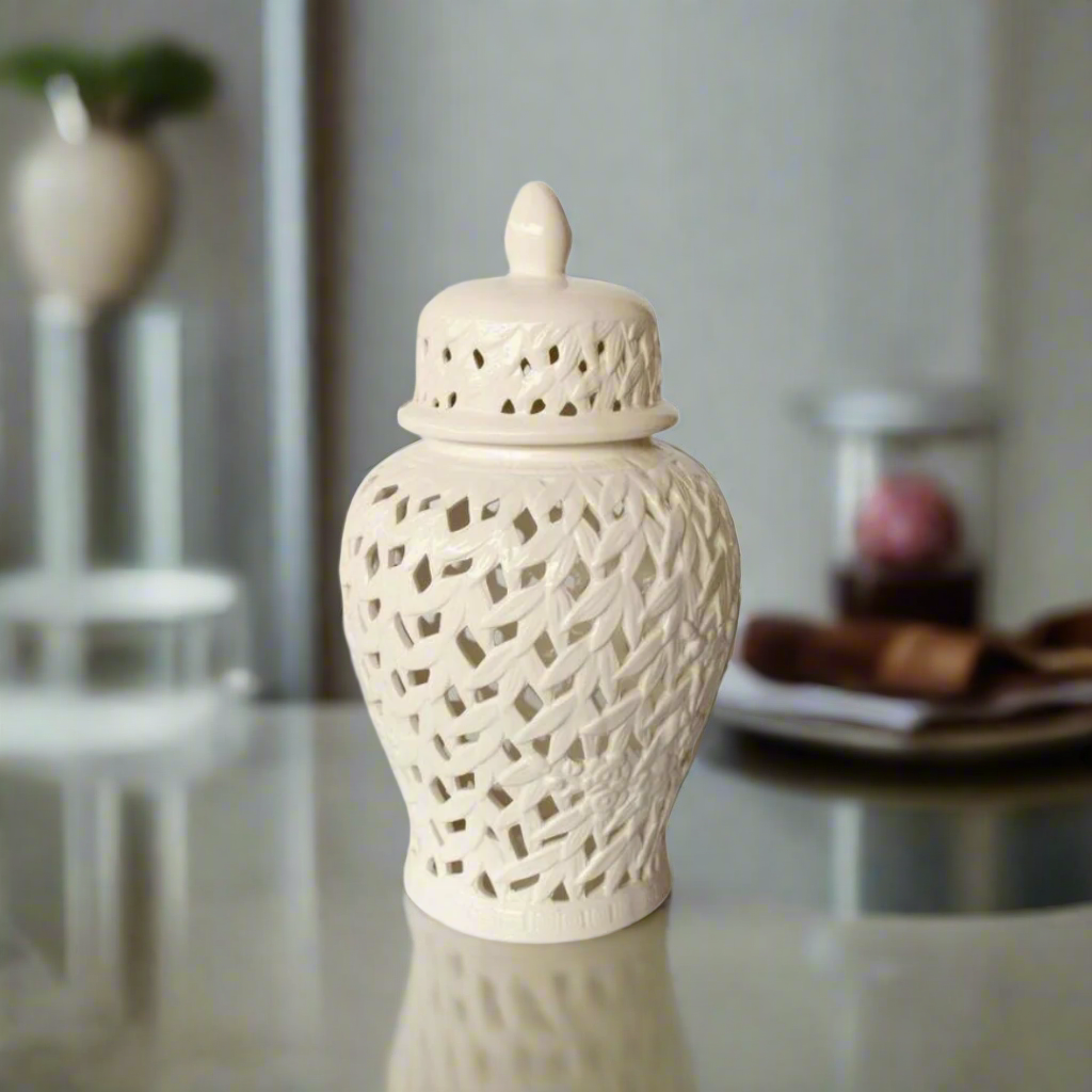 Elegant Decor Inspiration: White Flower &amp; Leaf Cut-Out Ginger Jar
Add a sophisticated touch to your home decor with our exquisite White Flower &amp; Leaf Cut-Out Ginger Jar. This stunning, handcrafted piece is carefully designed to bring elegance and charm to any room. Measuring 45cm x 25cm, its generous size makes it a perfect statement piece for decorative display on bookshelves, mantels, console tables, or any space that needs a touch of refinement.uniqueboys.